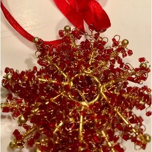 Snowflake ornaments: red, green, gold and silver. 8 total, 2 each color.